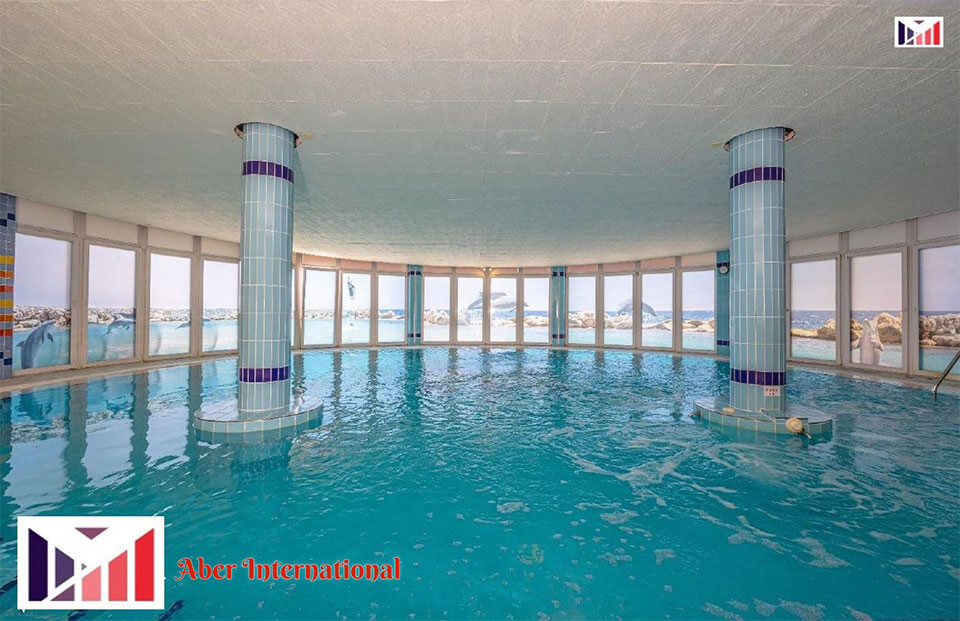 A spacious pool with a view of the sea